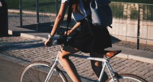 woman riding white rigid bike