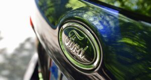 green and silver nissan car