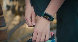 person wearing black and green nike air max
