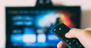 turned-on flat screen television