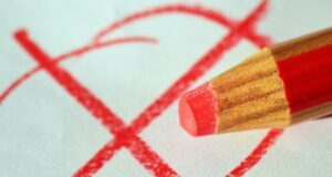 pen, red pen, mark with a cross