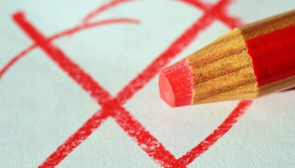 pen, red pen, mark with a cross