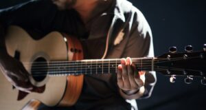 person playing guitar