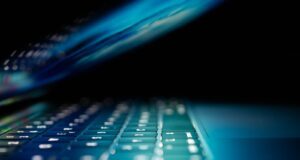 closeup photo of turned-on blue and white laptop computer