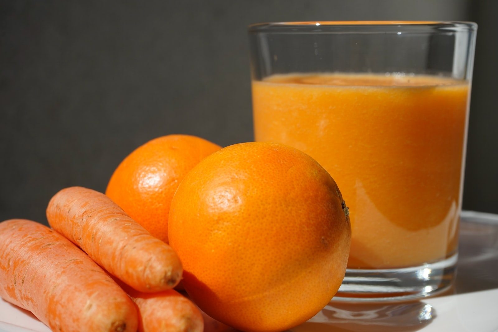 orange fruit on clear glass bowl