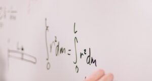 person writing on white paper