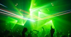 people dancing inside room with green lights