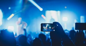 person taking picture on stage