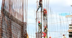 people working on building during daytime