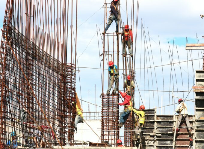 Photo by Josue Isai Ramos Figueroa people working on building during daytime