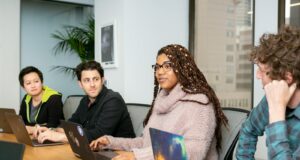 people in a group discussing app development
