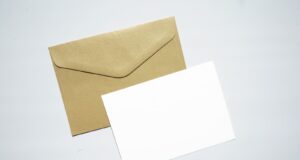white printer paper on brown envelope