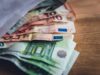 euro banknote collection on wooden surface