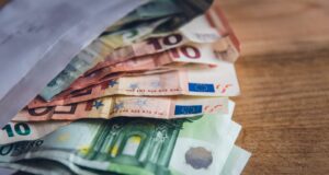 euro banknote collection on wooden surface