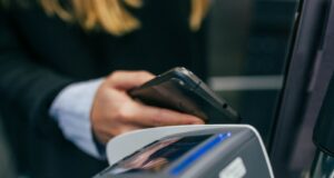 shallow focus photography of person holding smartphone