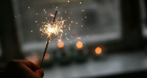 person holding sparkler