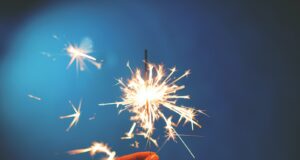 person holding sparkler