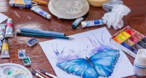 blue and purple click pen on white paper