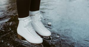 person wearing white leather boots