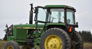 green tractor on brown soil