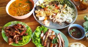 pasta with vegetables near meat with cabbage and stewed food in bowl