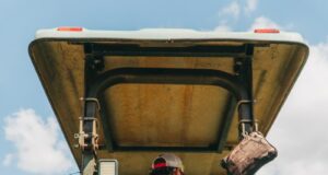 man riding tractor