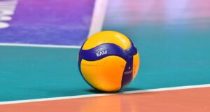 a yellow and blue ball on a pool table