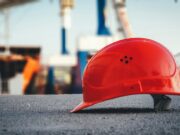red hard hat on pavement