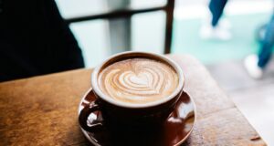 latte art in brown cup in macro photography