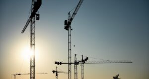 a group of cranes that are next to each other