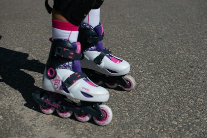 a close up of a person riding roller skates