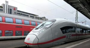 silver and red bullet train
