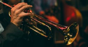 person playing trumpet during night time