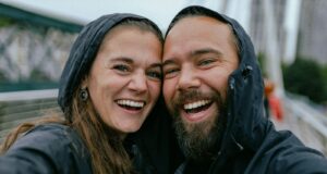 a man and woman smiling