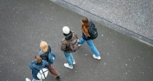a group of people walking down a street