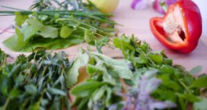 closeup photo of red pepper and herbs