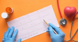 person writing on white paper