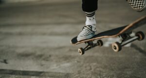 person jumping with skateboard