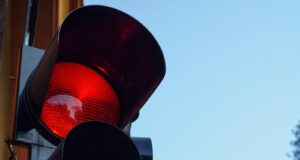 black traffic light with red light