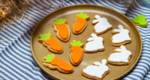 a plate of decorated cookies on a table