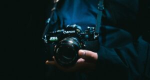 a person holding a camera in their hand