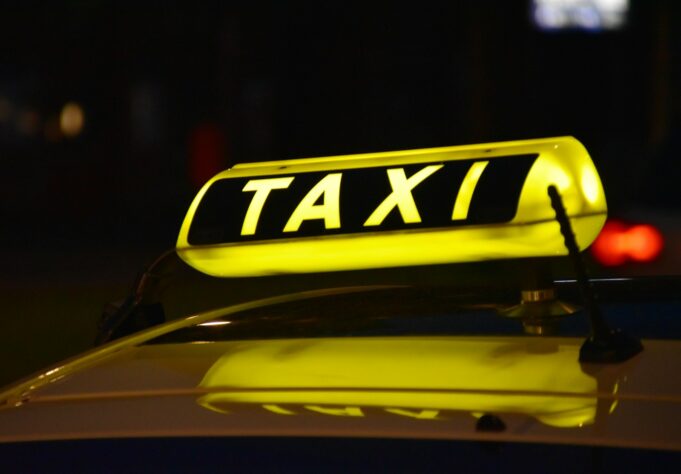 Photo by Waldemar yellow Taxi light sign