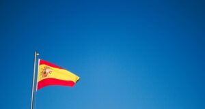 orange and yellow flag in pole