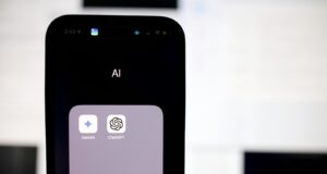 a close up of a cell phone with an ai button
