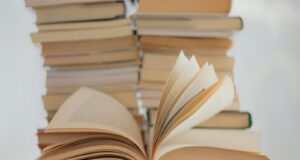 white book on brown wooden table
