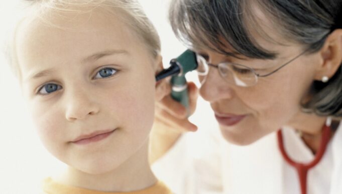 Girl being examined by doctor